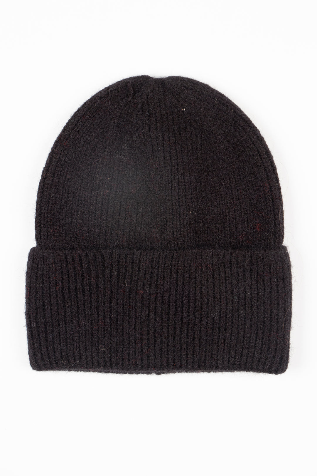plain black knitted beanie hat laying flat, showing a foldable brim