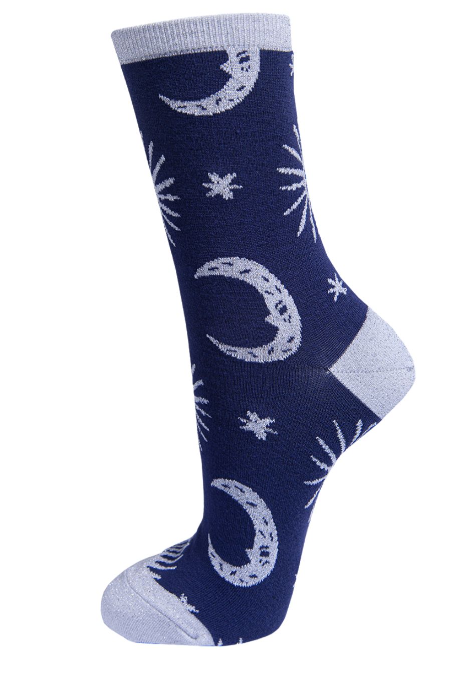 blue socks with grey, stars, crescent moons and suns with silver sparkly glitter accents
