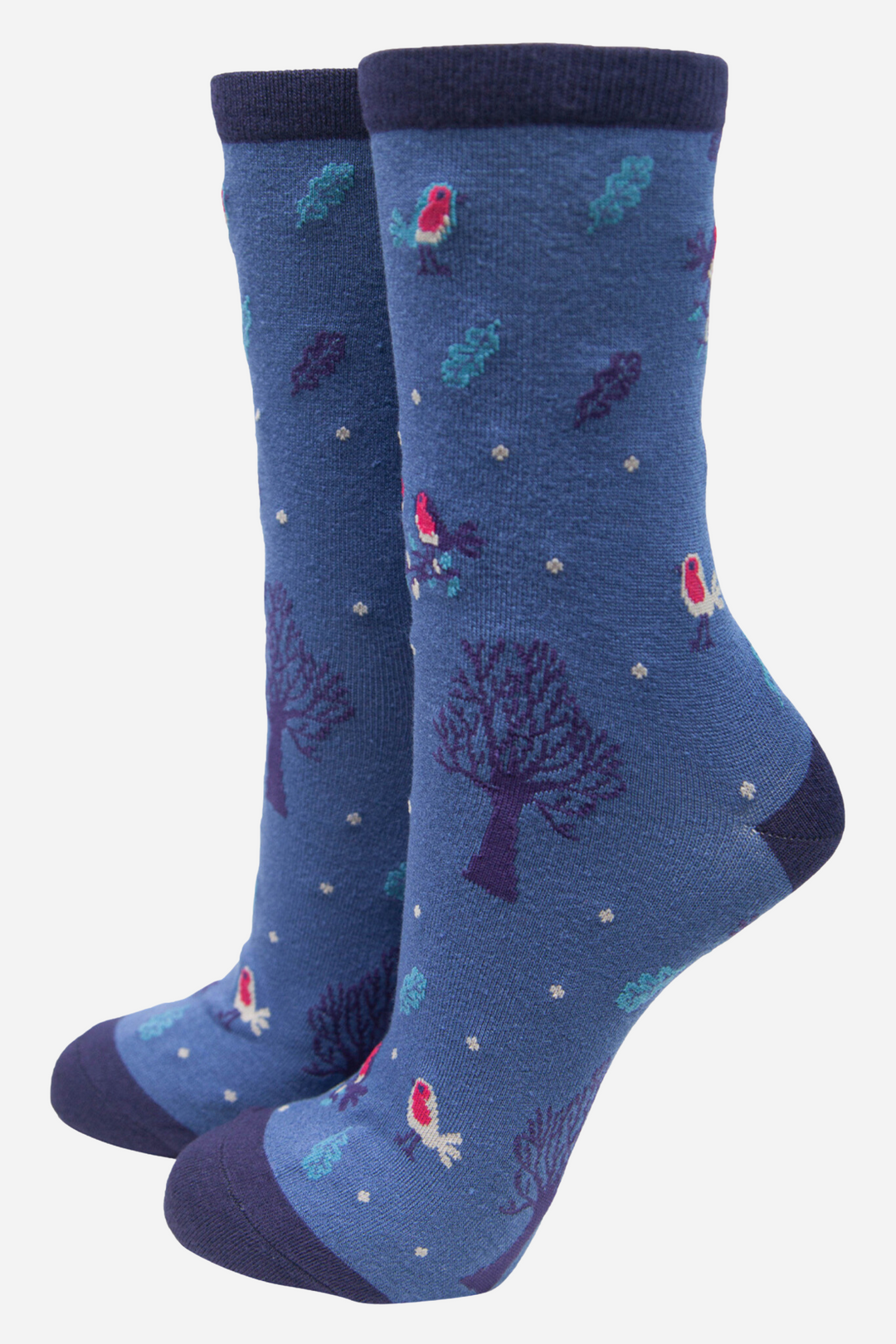 blue socks with a pattern of red robins, trees, leaves and snow, with a dark blue heel, toe and cuff