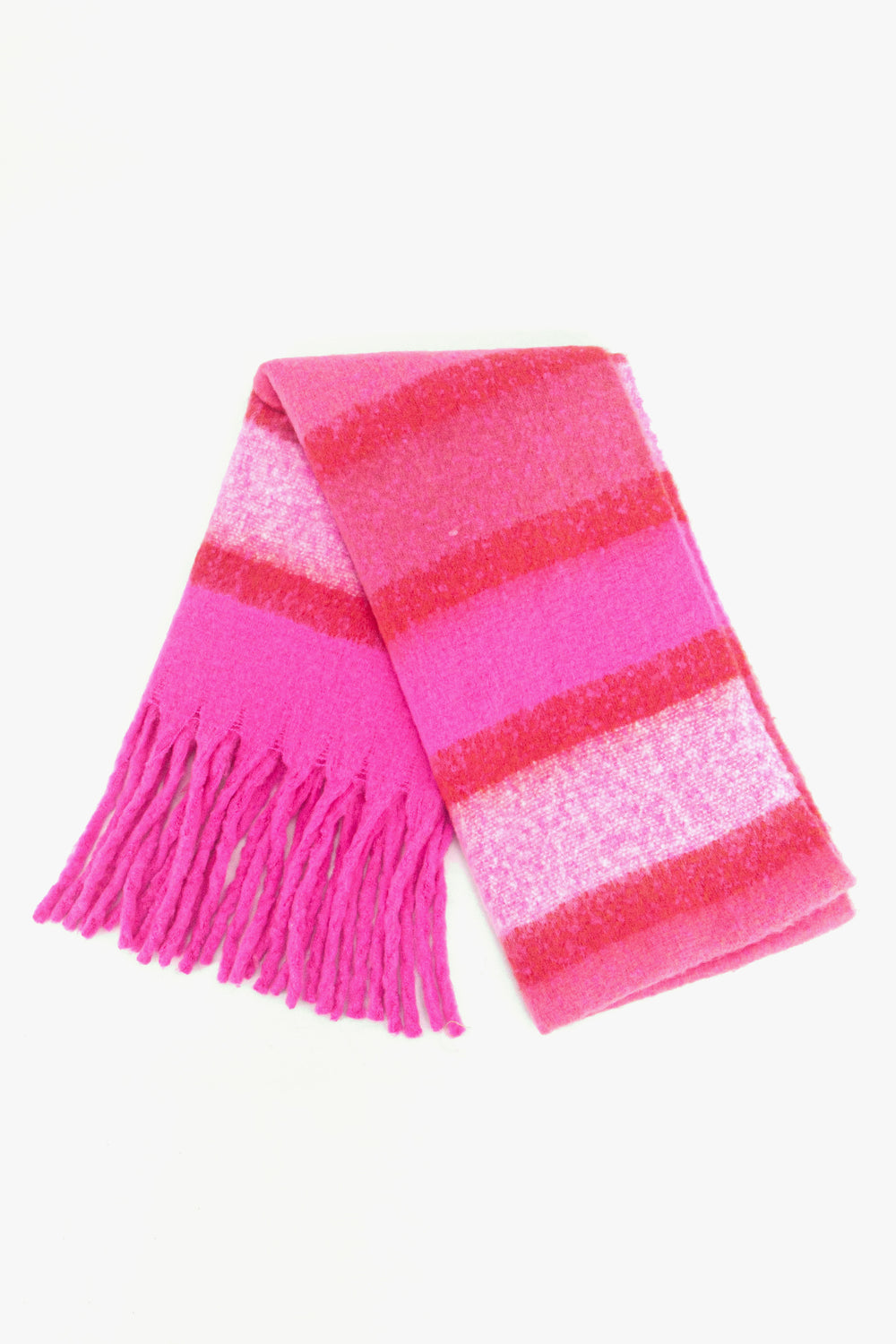 showing the scarf folded while laying flat, the striped fuchsia pink colour block pattern is highlighted.