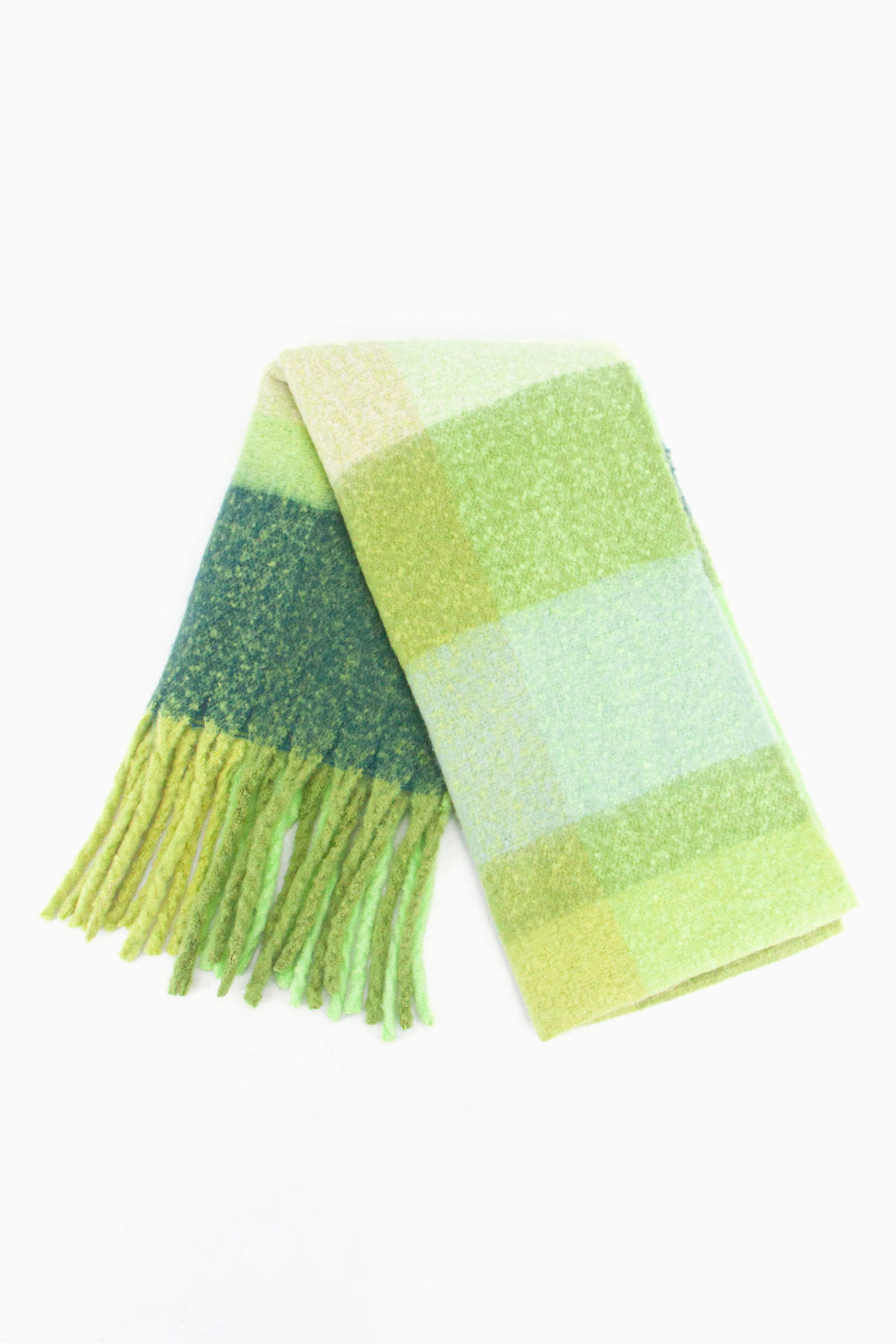 showing the scarf folded while laying flat, the green square colour block pattern is highlighted.