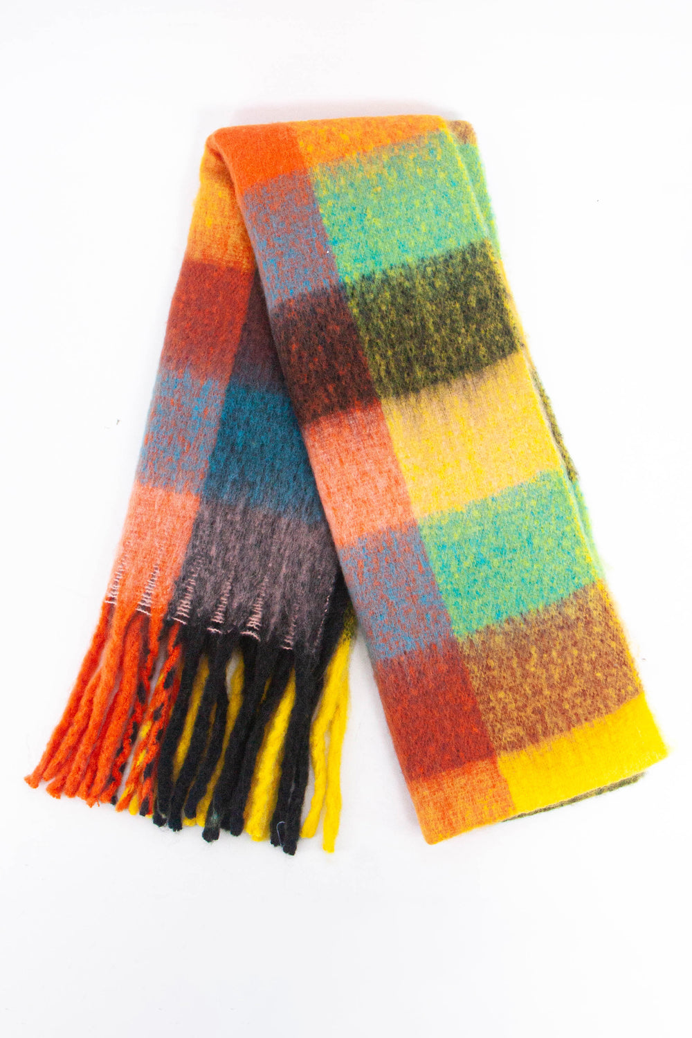 showing the scarf folded while laying flat, the multi colour  square block pattern is highlighted. there are yellow, orange, green, black and blue tones visible in the design.