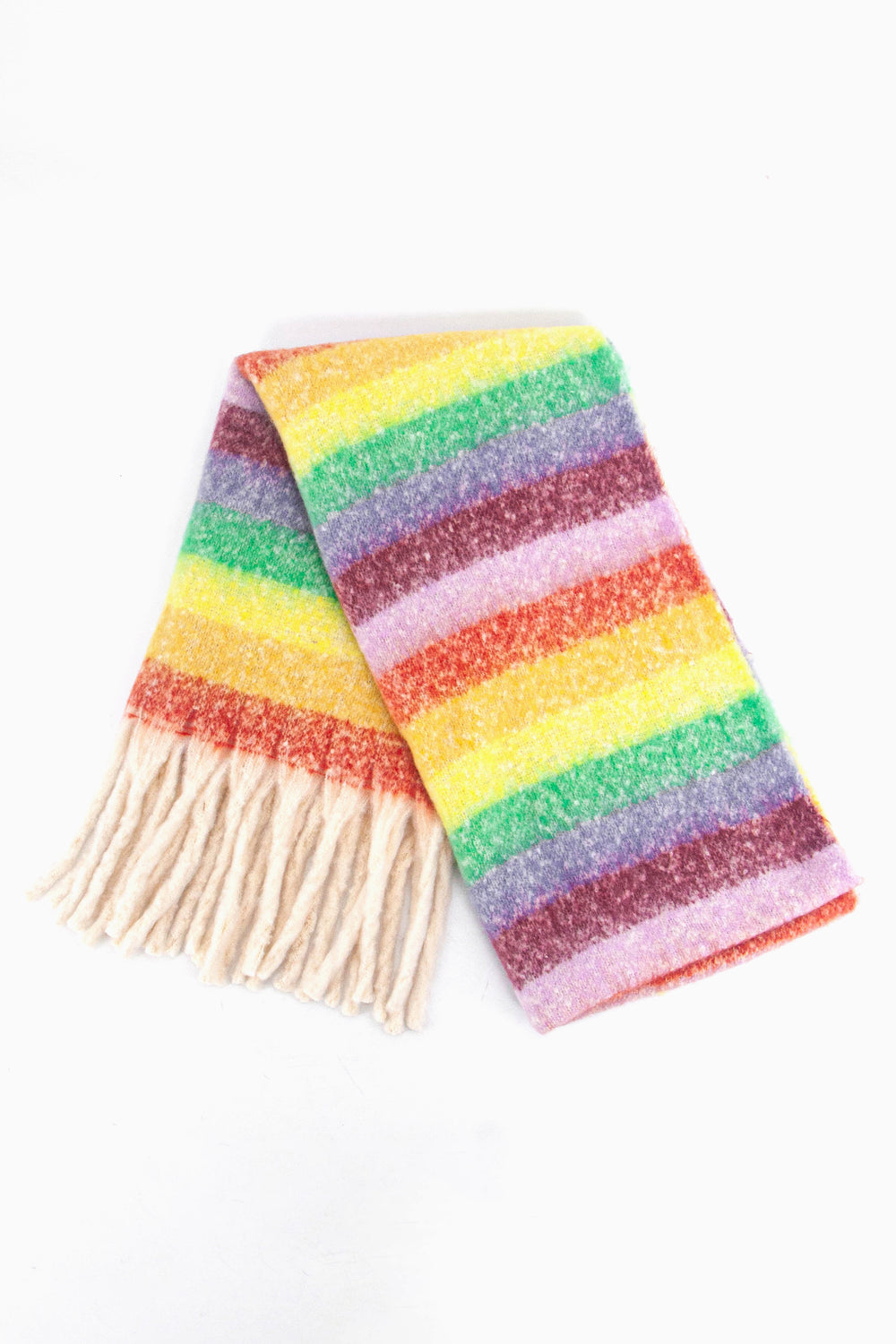 showing the scarf folded while laying flat, the multi colour rainbow stripe pattern is highlighted. there are yellow, orange, green, pink, purple and blue tones visible in the design.