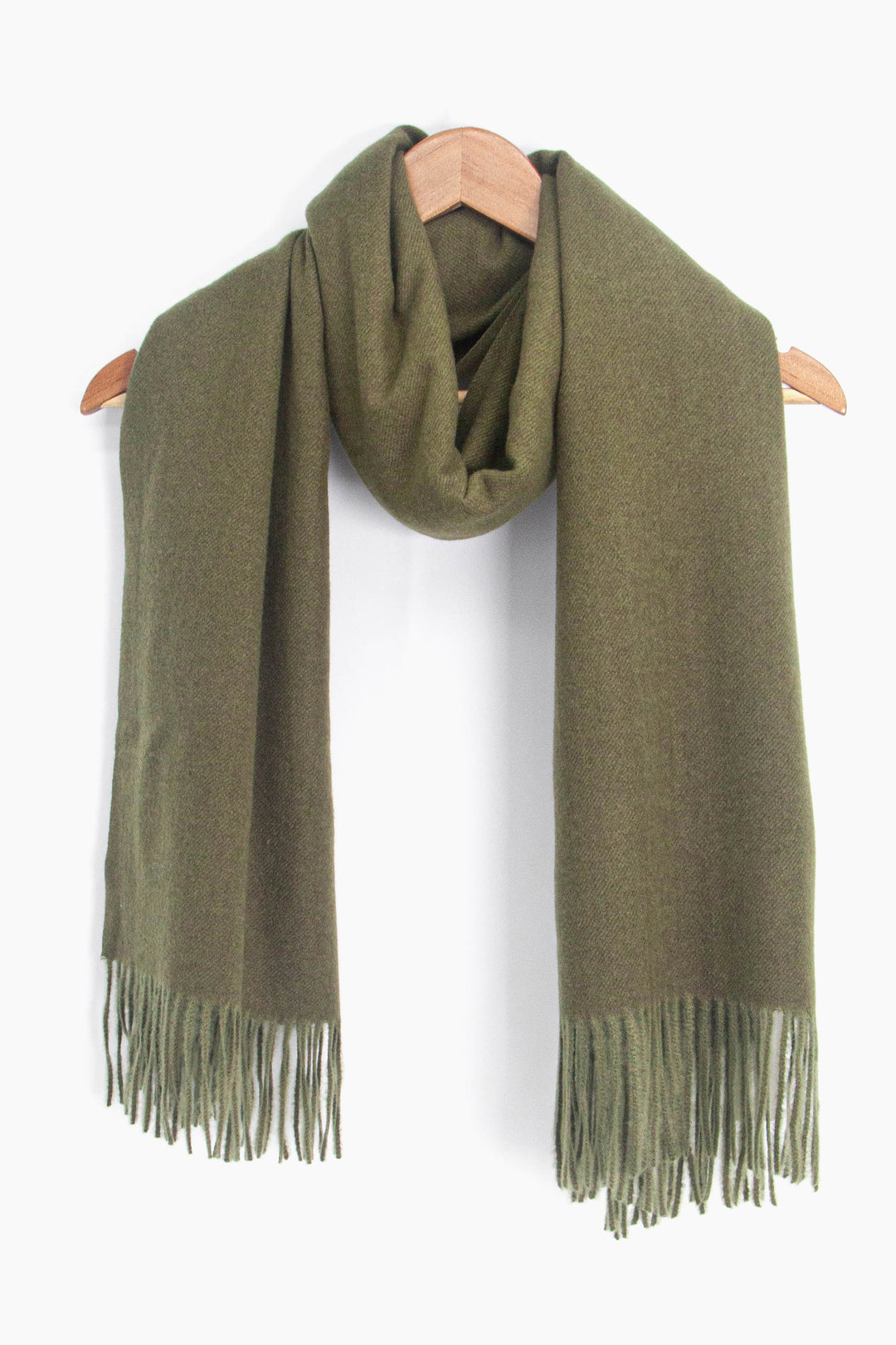 showing the khaki green winter scarf draped around a coat hanger