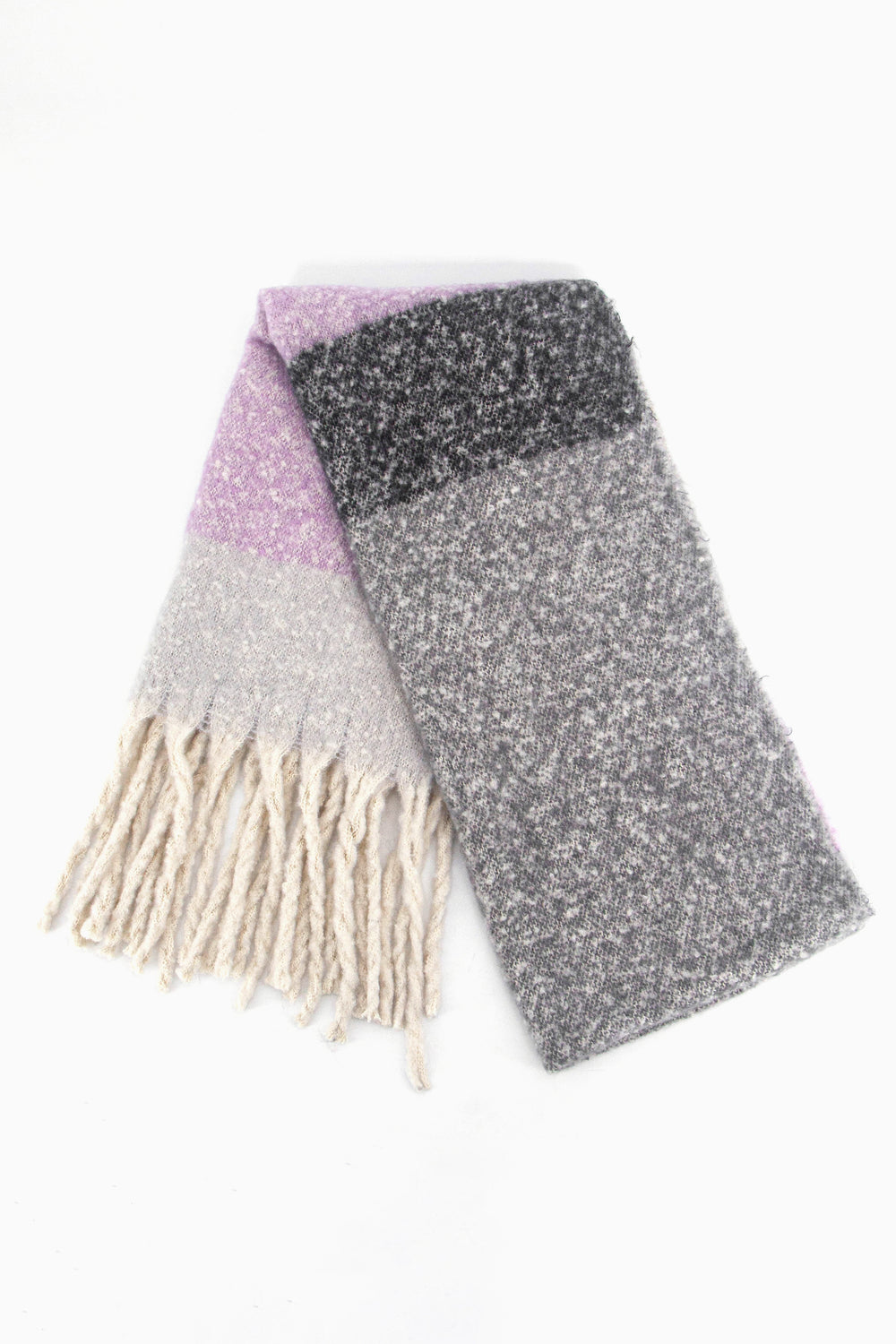 showing the scarf folded while laying flat, the grey and lilac colour block design is clearly shown as is the cream tasselled fringe.