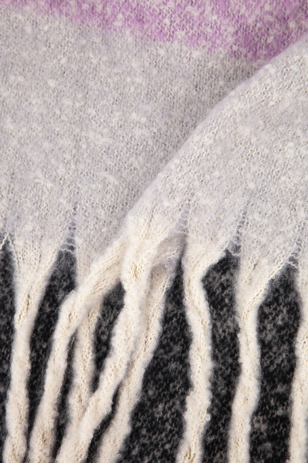 close up of the soft viscose knitted material of the winter blanket scarf