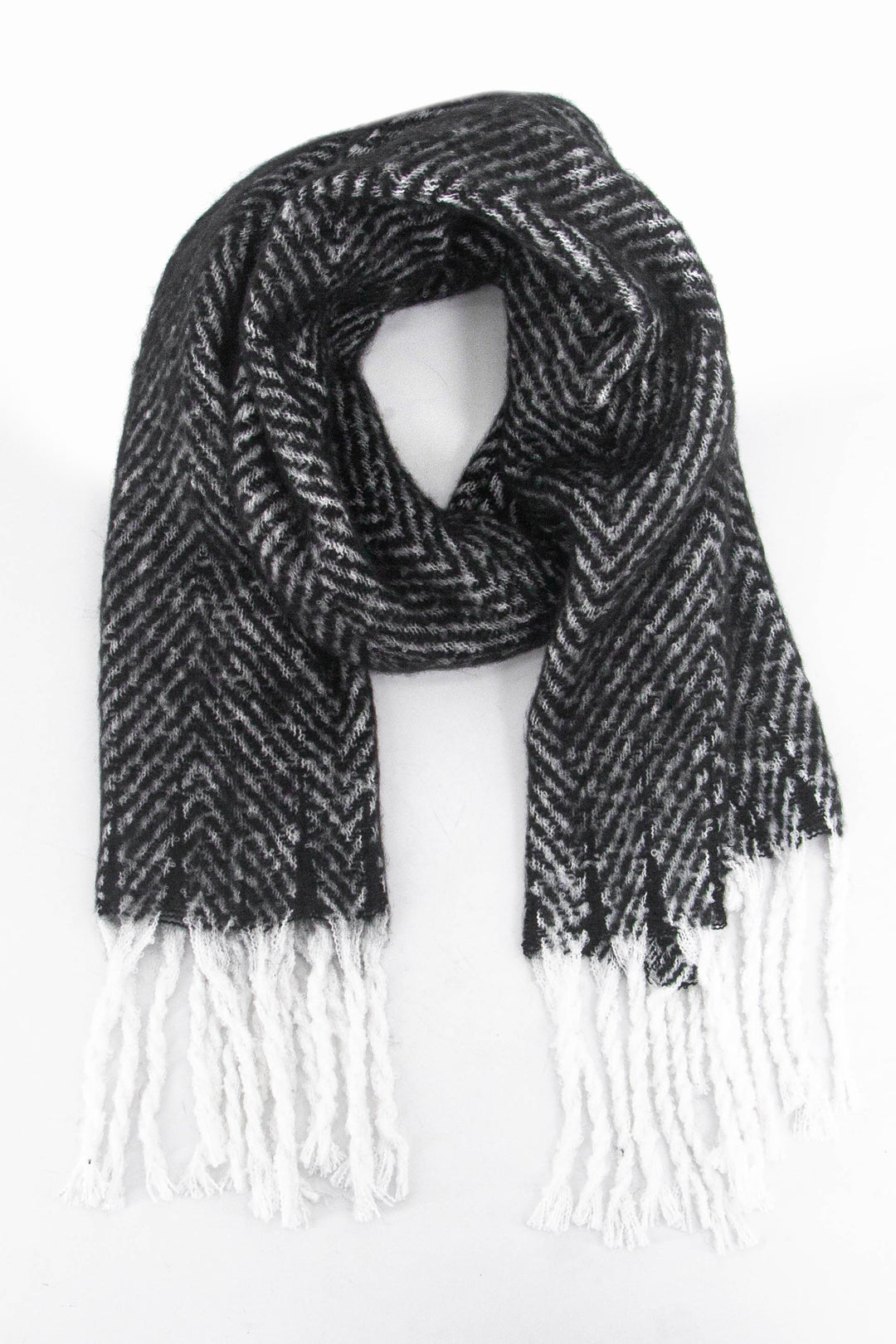 black herringbone pattern knitted winter scarf with a contrasting white tassel trim