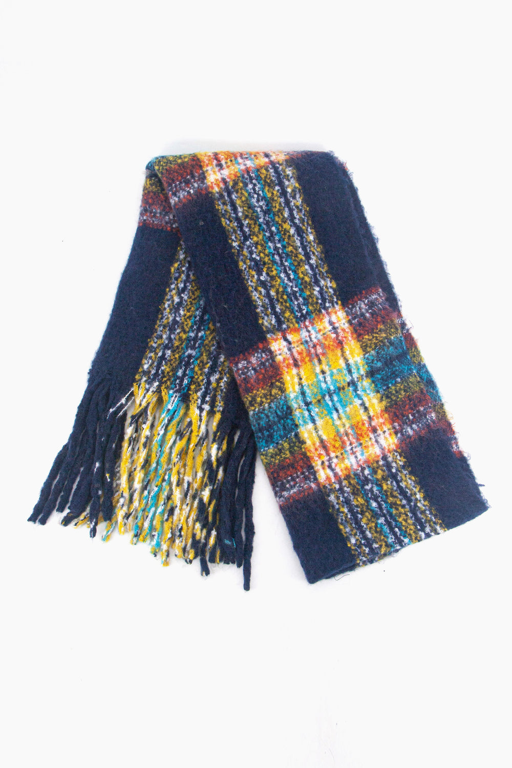 showing the scarf folded while laying flat, the navy blue tartan checked pattern is clear as is the colourful tassel trim.