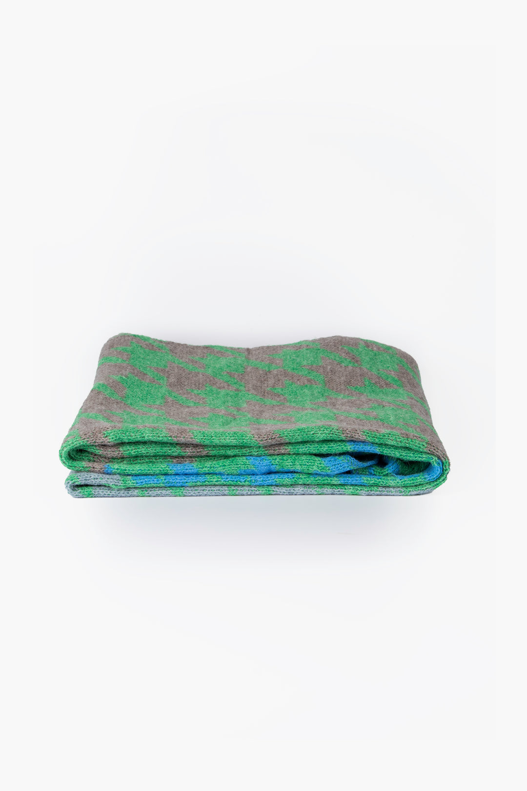 side view of the scarf when folder, showing the texture and thickness of the material. this scarf is warm and winter weight