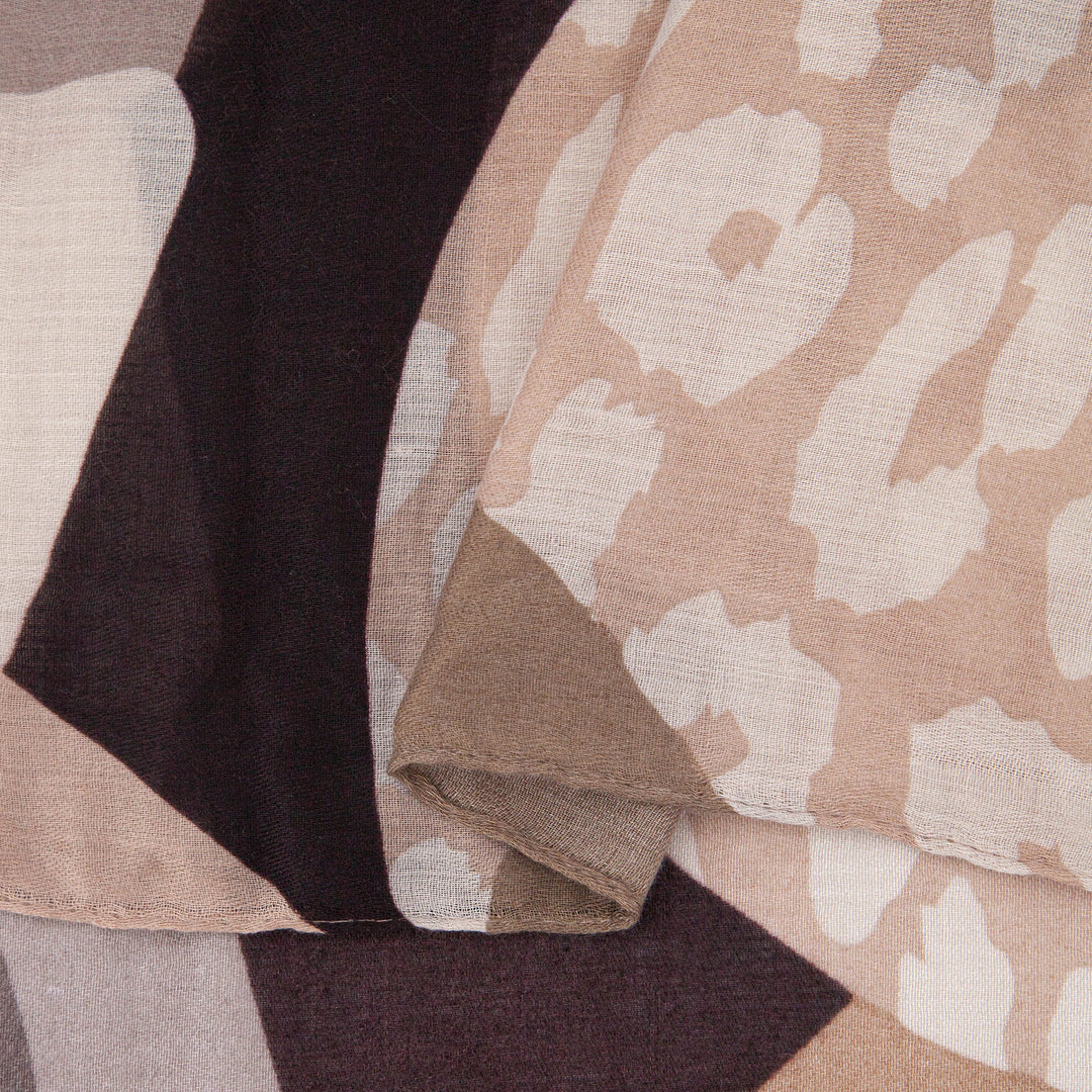 close up of the soft viscose fabric, the neutral tone colourways and leopard print pattern are clearly visible