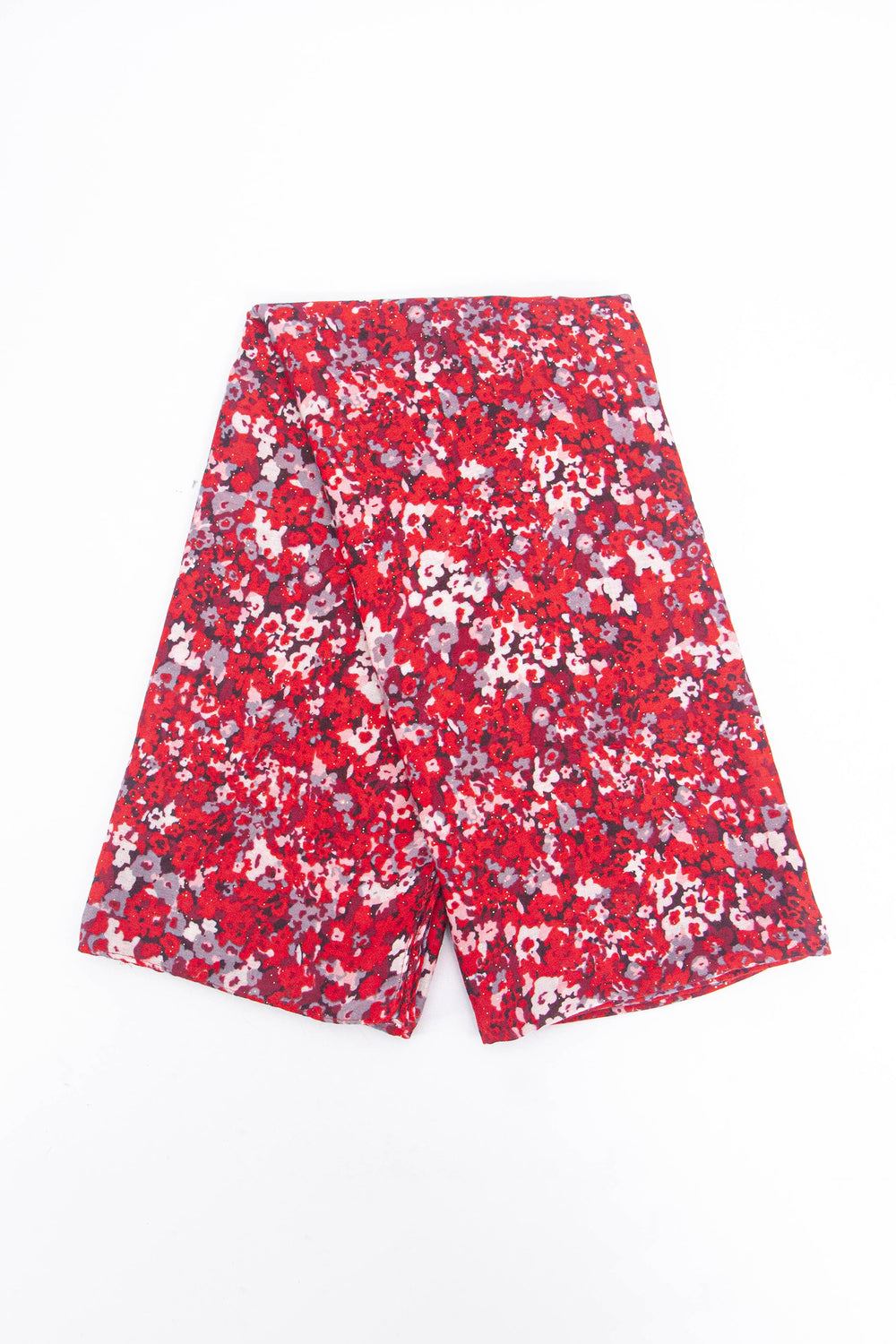 showing the scarf folded, the red and white floral print pattern is shown to cover the whole of the design.