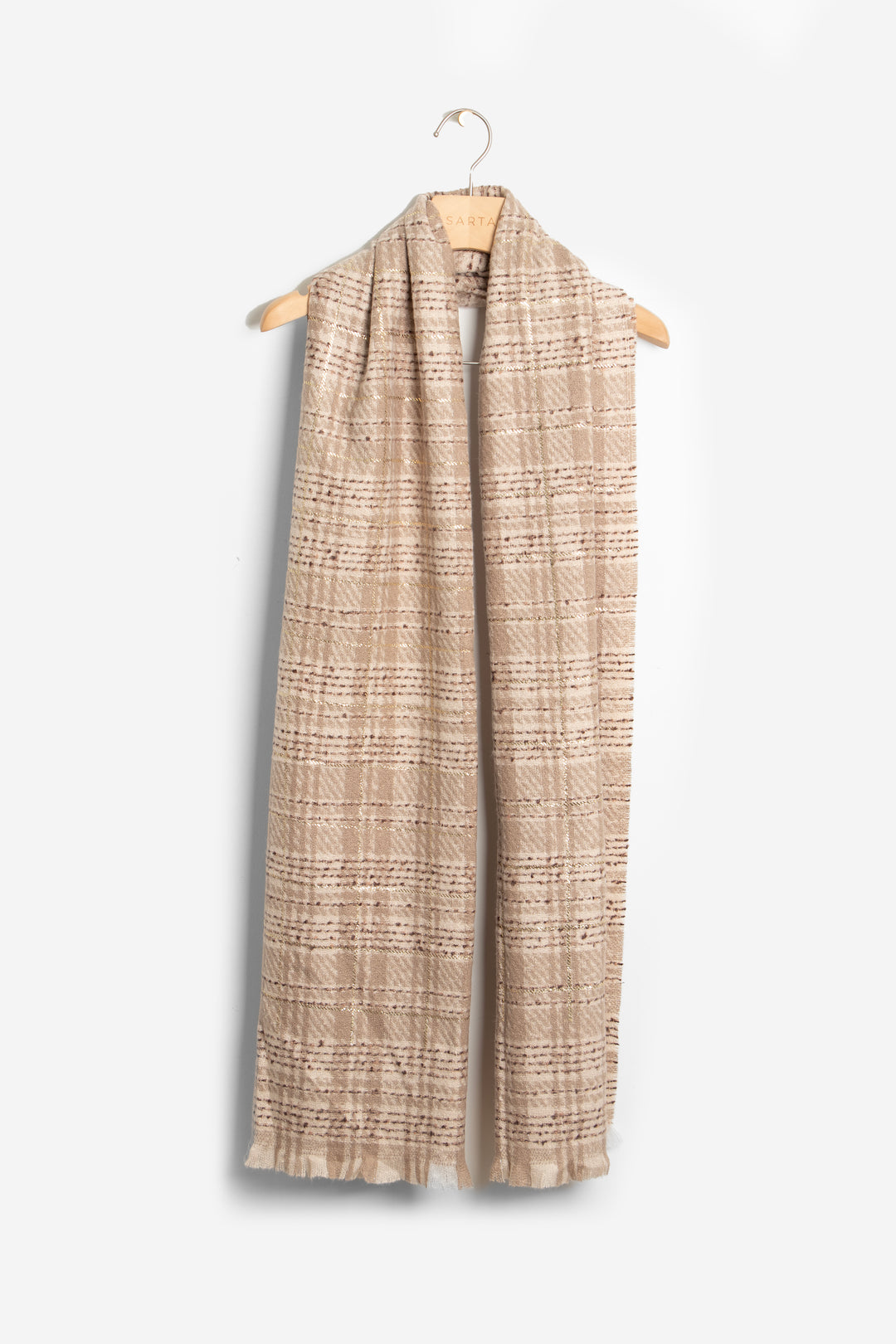 showing the scarf draped around a coat hanger, showing the all over pattern and how it would look when worn