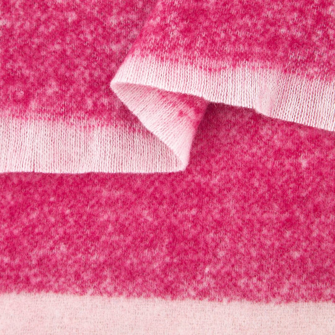 close up of the soft viscose fabric, the block stripe print pattern is clearly visible as is the fringed edge hem