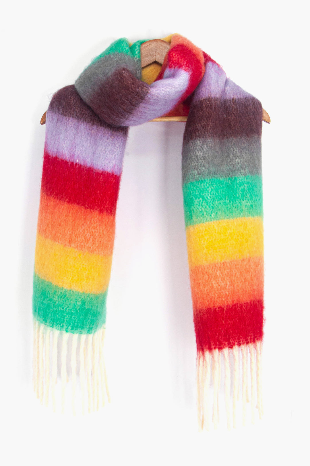 showing the multicoloured striped winter rainbow scarf draped around a coat hanger, showing how it would look when worn