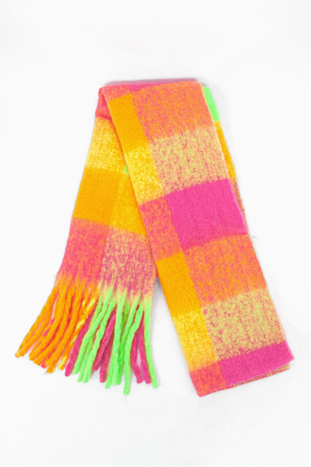 showing the scarf folded while laying flat, the check pattern is highlighted. there are pink, orange, yellow and green tones visible in the design.