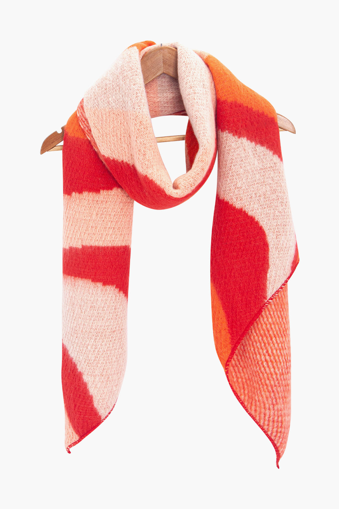 ramona-orange-red-waves-heavyweight-scarf-draped-on-coat-hanger