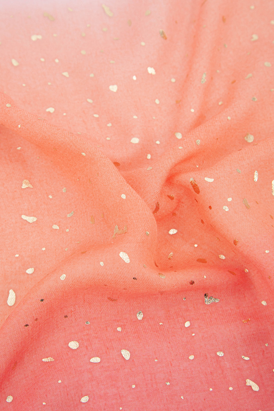 close up of the lightweight material and gold foil pattern on the scarf
