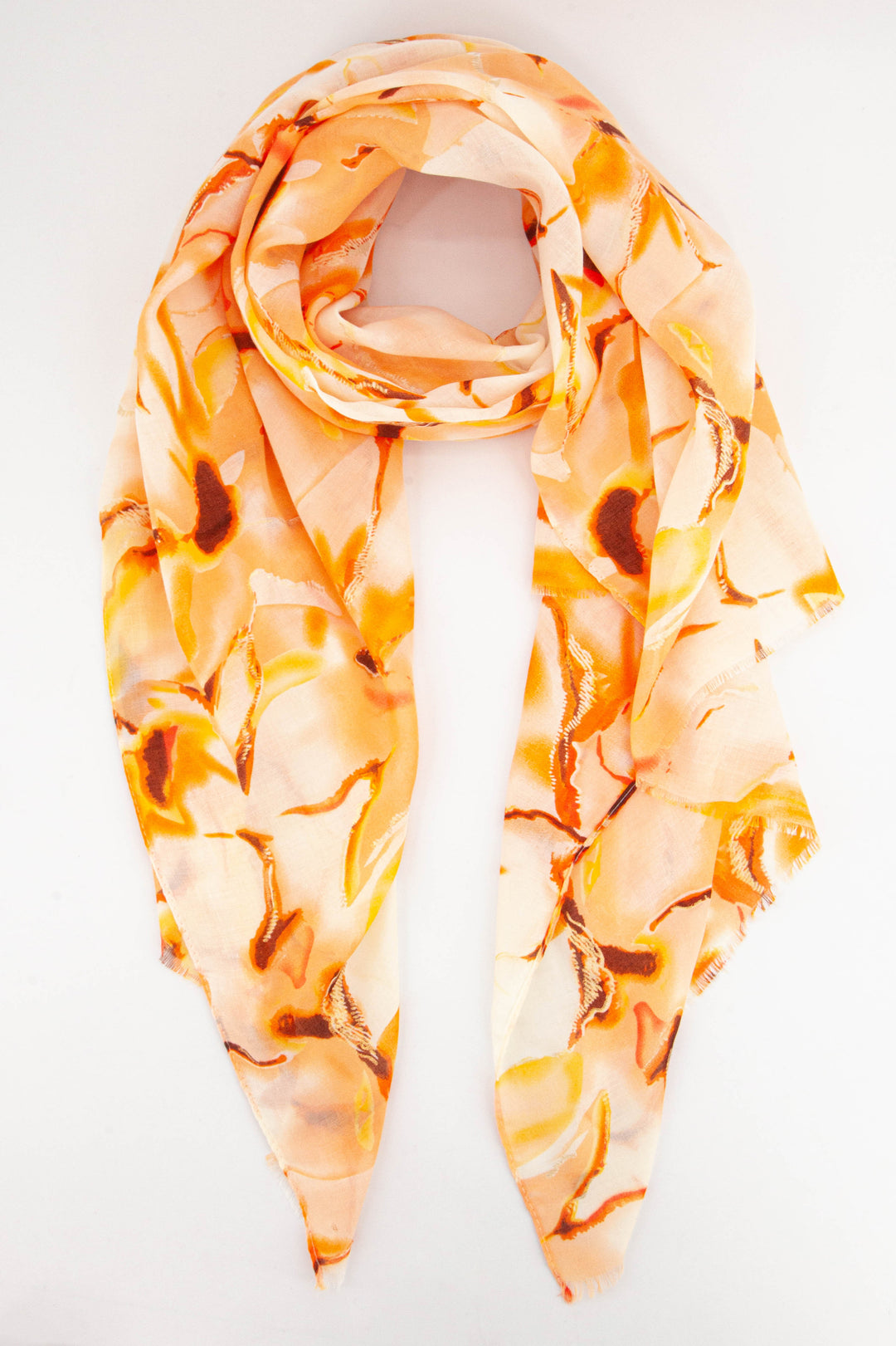 orange tie dye scarf with gold foil accents throughout, the tie dye is in a wave print