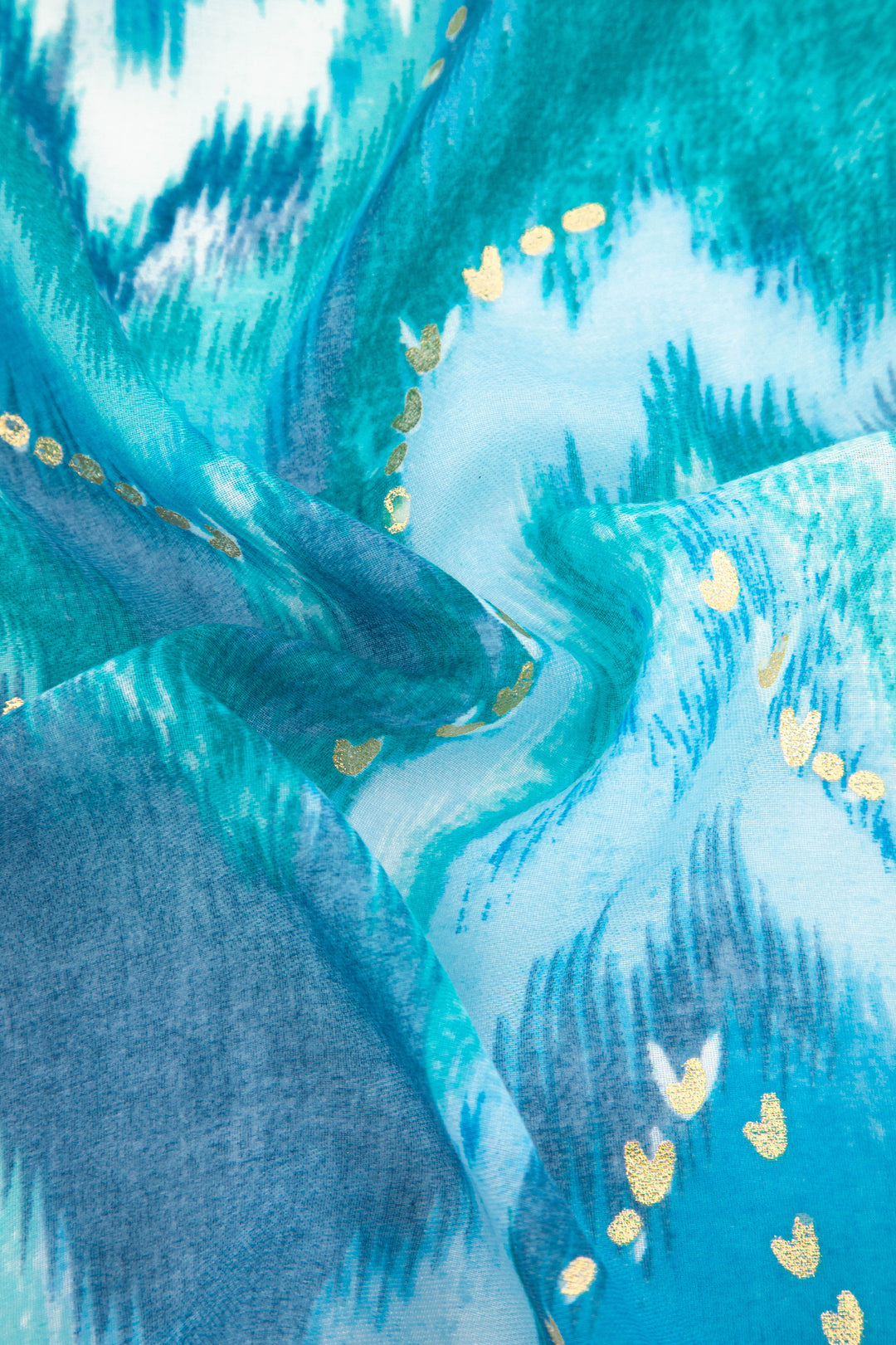 close up of the blue watercolour scarf and the gold foil accents
