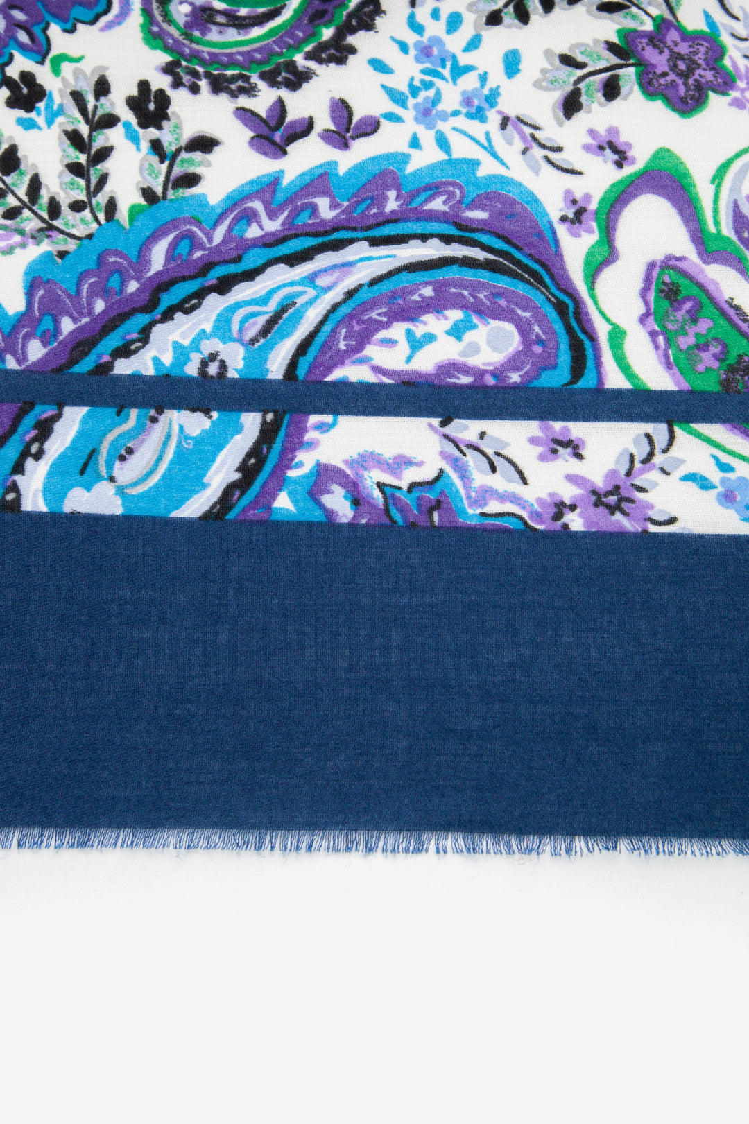 close up of the blue colour block border on the paisley pattern lightweight summer scarf