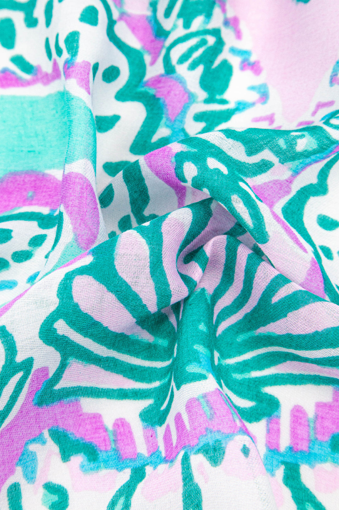close up of the lightweight material and ornate seashell pattern