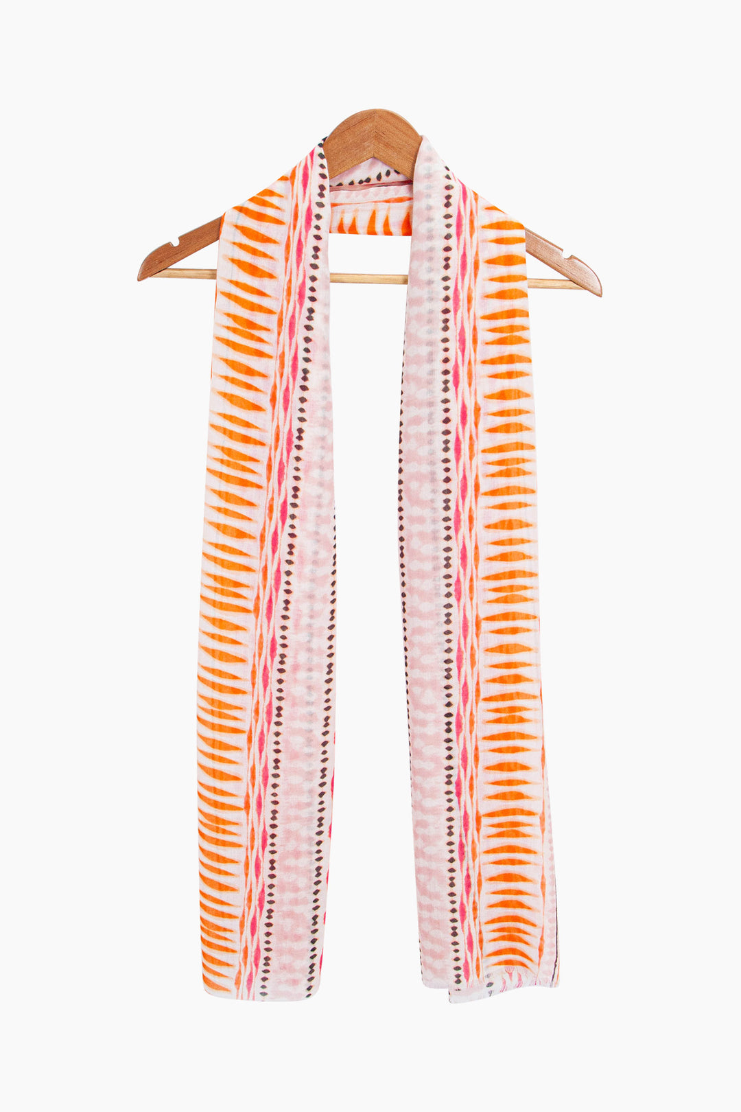 madeline-lightweight-scarf-pink-boho-geometric-draped-around-a-coat-hanger