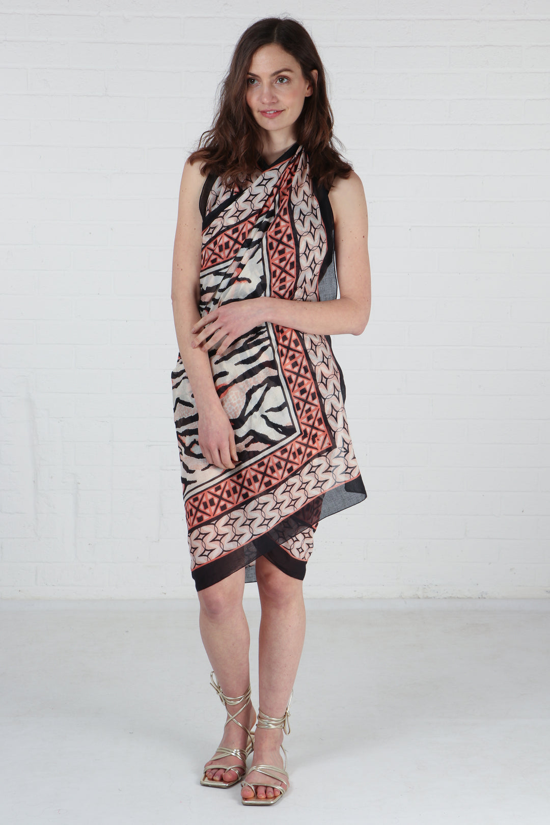 model wearing this animal and mosaic pattern cotton scarf as a beach cover up dress