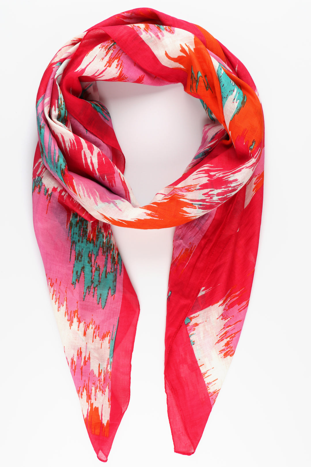 pink scarf with an abstract chevron print pattern