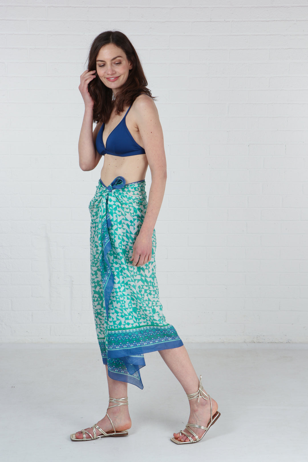 model showing that this cotton scarf can be worn as a beach sarong
