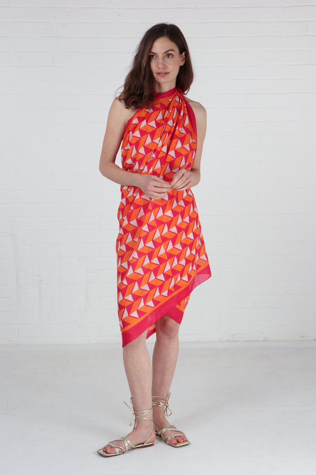 model wearing this geometric scarf as a beach cover up dress