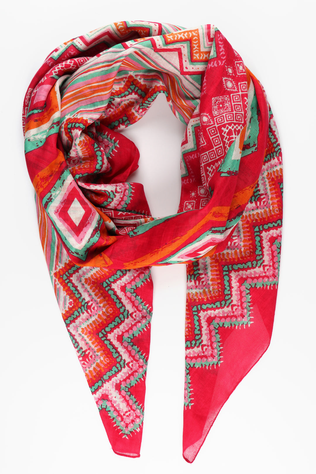 pink cotton scarf with geometric ikat diamond shaped patterns and zig zag lines in green