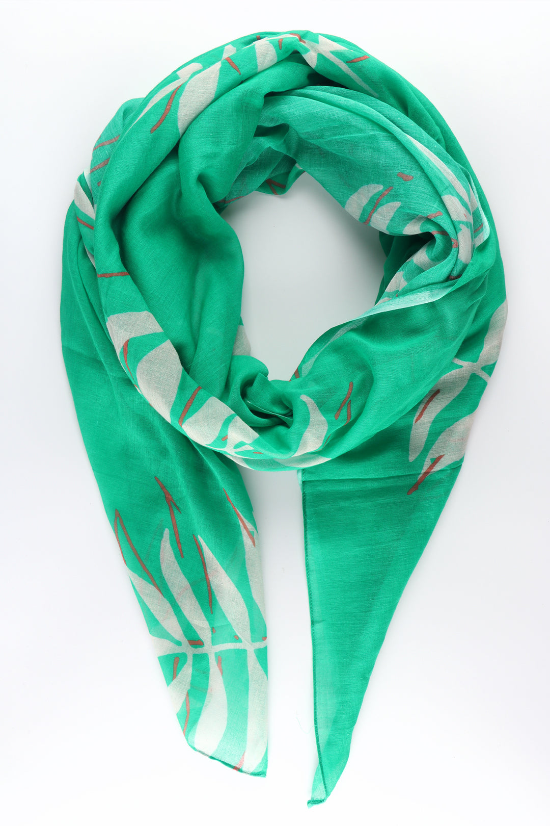 green cotton scarf with a pattern of tropical palm leaves