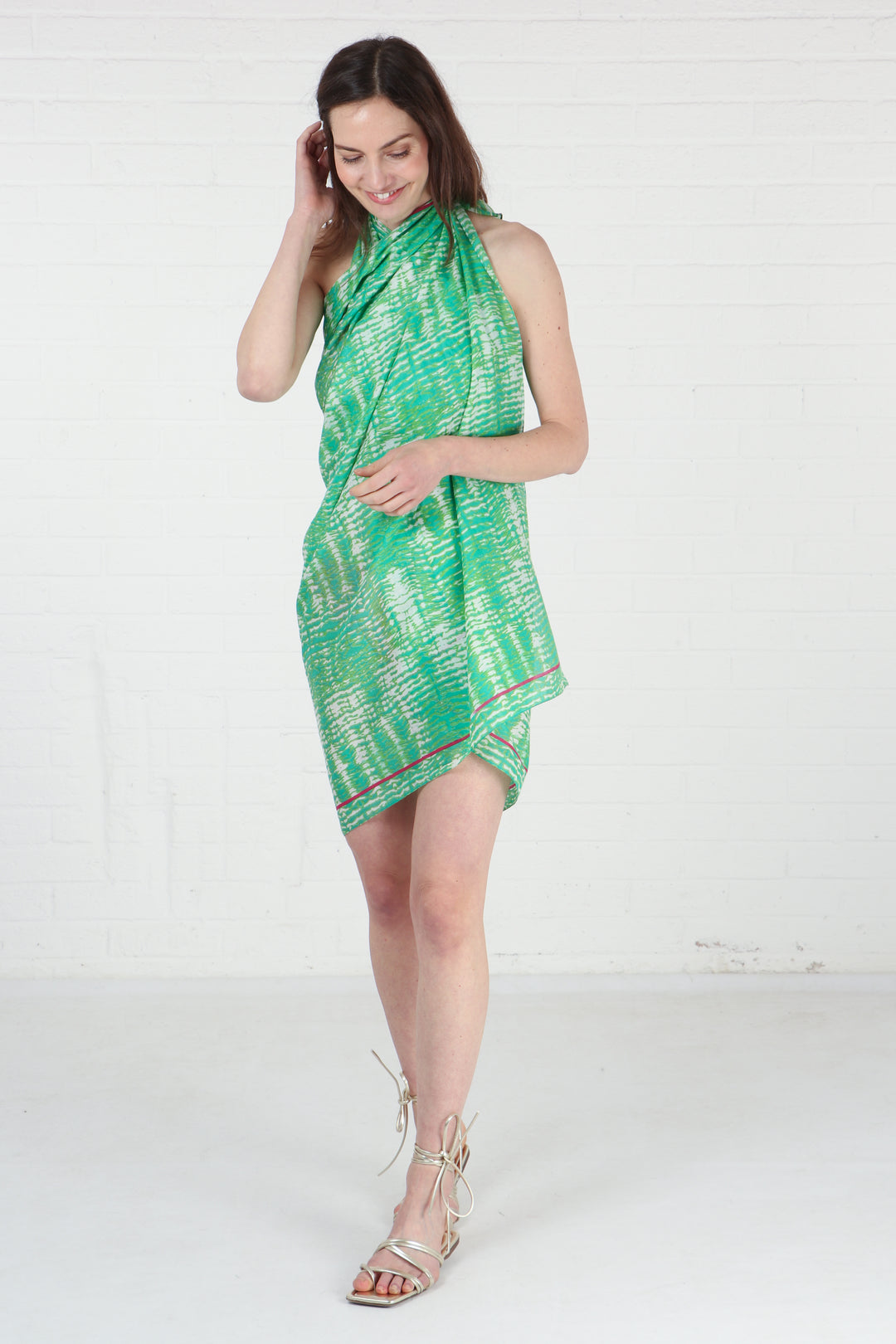 model wearing this green tie dye cotton scarf as a beach coverup dress