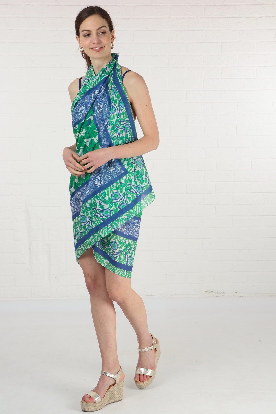 model wearing this green and blue cotton scarf as a beach cover up dress