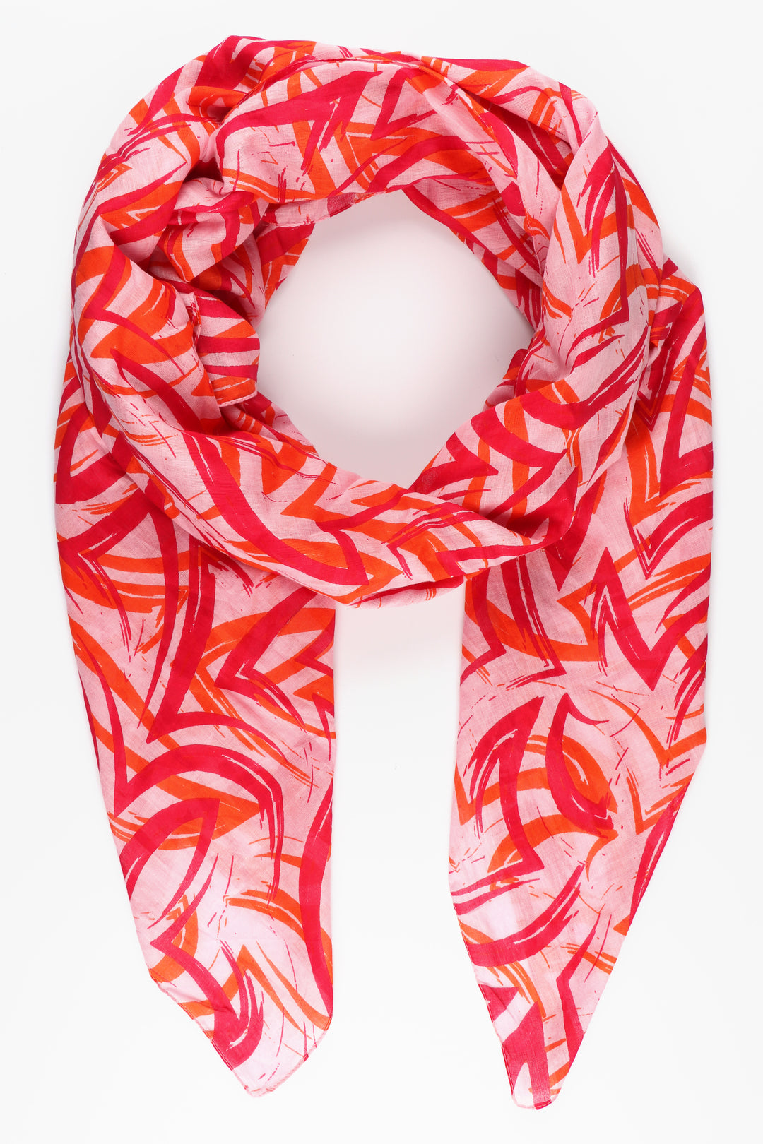 pink cotton scarf with an all over pattern of artistic brushstrokes in pink and coral