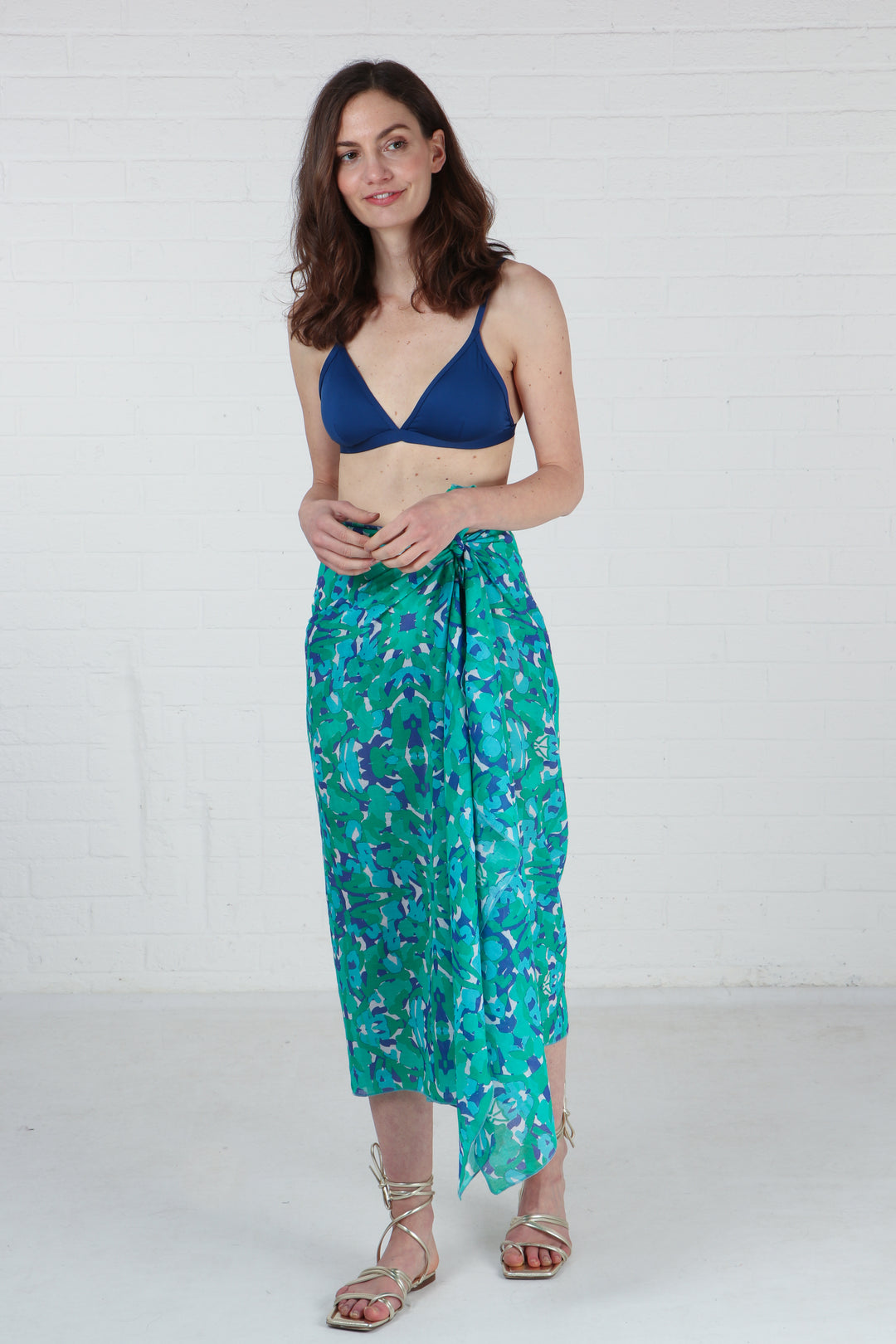 model wearing this green scarf as a beach cover up sarong