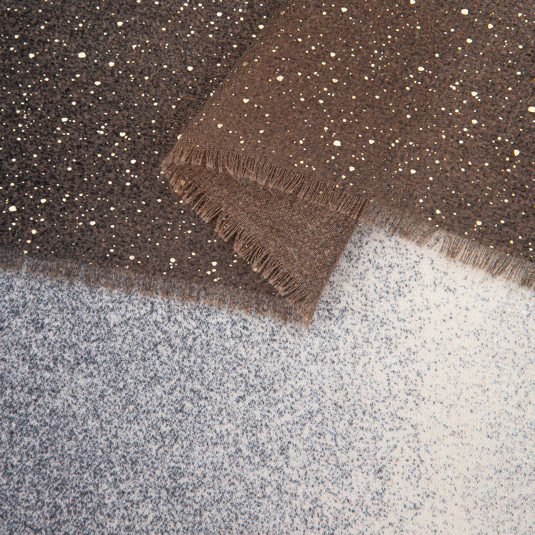 close up of the soft viscose fabric, the grey ombre and foil speckles are clearly visible.