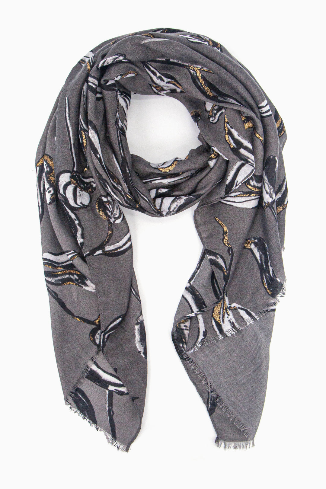 grey scarf with a large floral pattern in black and white with gold glitter accents throughout