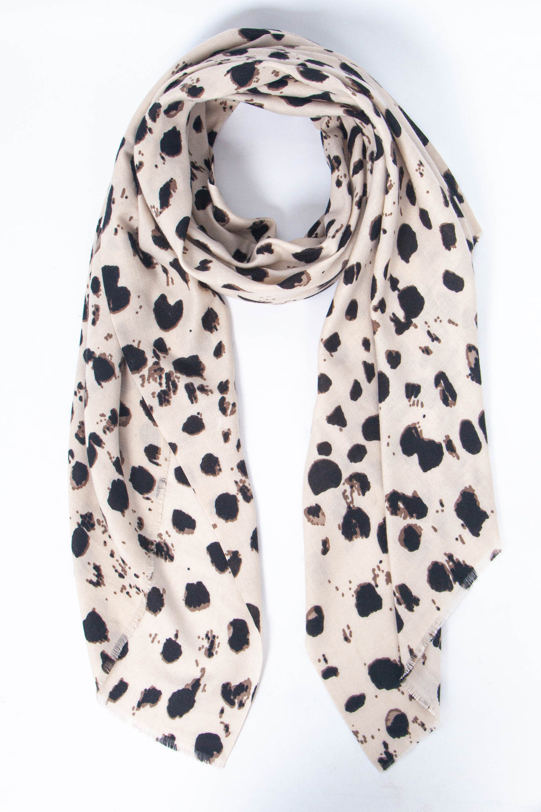 cream scarf with an abstract tonal leopard print pattern in black and brown.