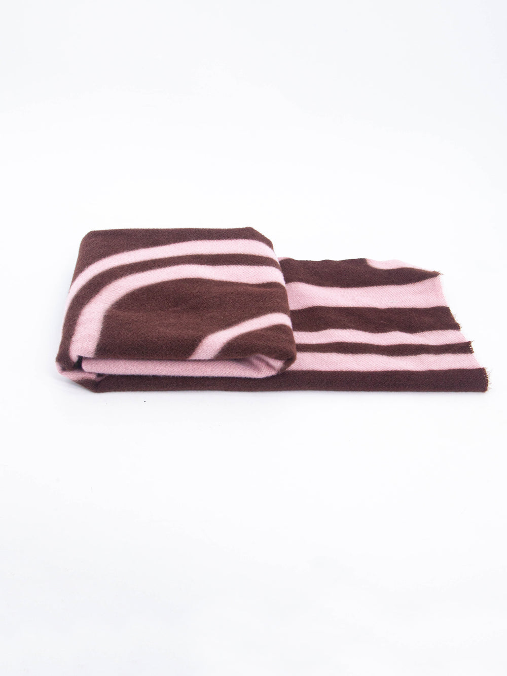 side view of the scarf when folded, showing the texture and thickness of the material. this scarf is midweight