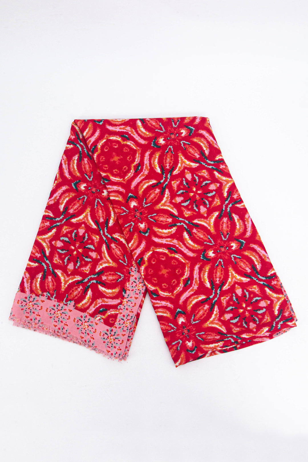 showing the scarf folded, the bold red mosaic floral pattern is shown and the pink patterned bordered edge contrasts the middle of the scarf