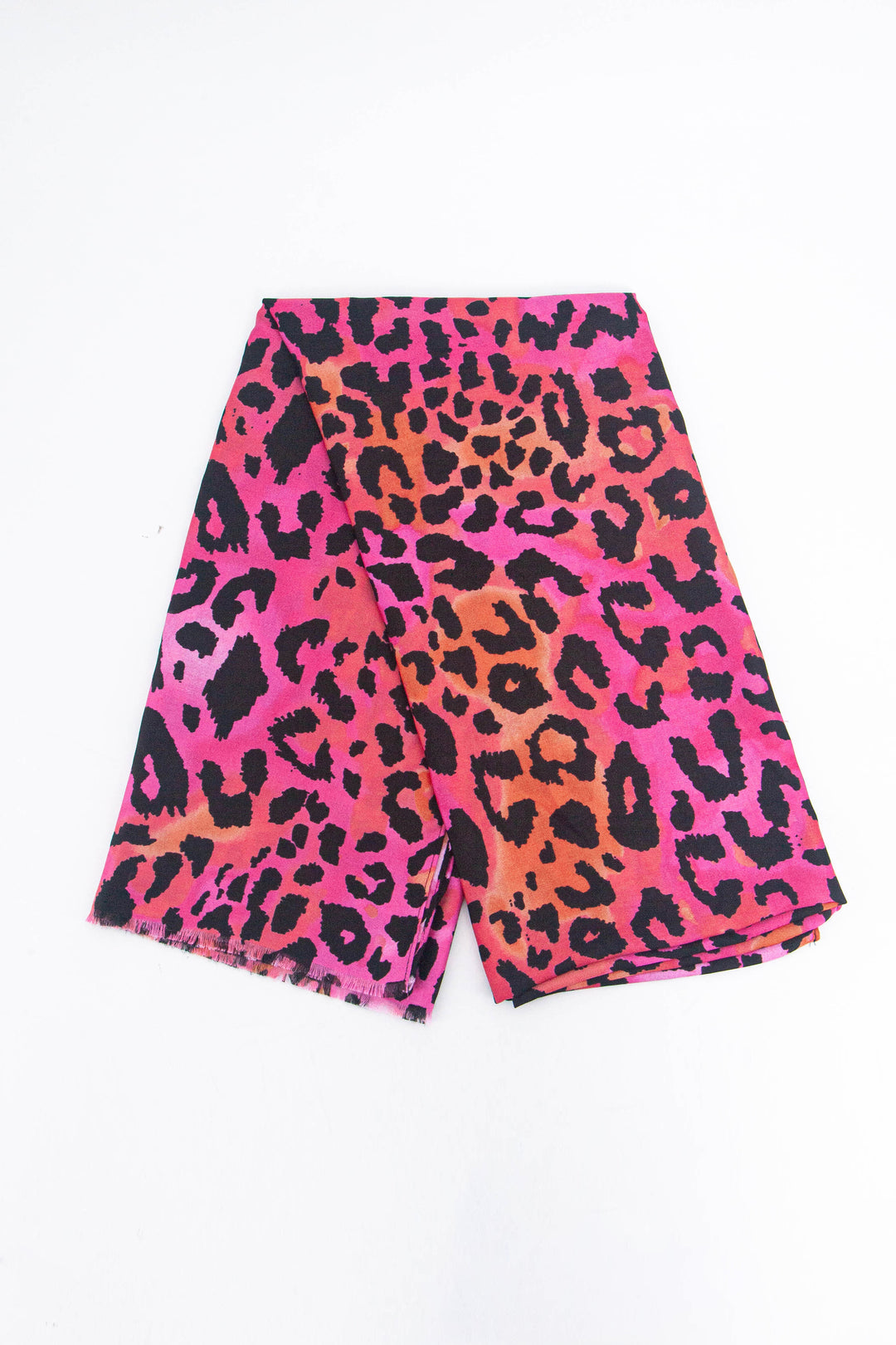 showing the scarf folded, the orange and pink blended leopard print pattern is shown to cover the whole design