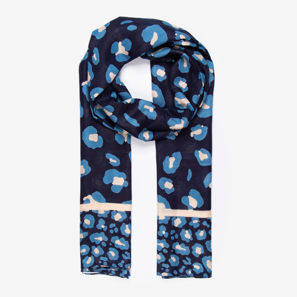 navy blue scarf with a light blue leopard print pattern, border stripe and bordered animal print pattern