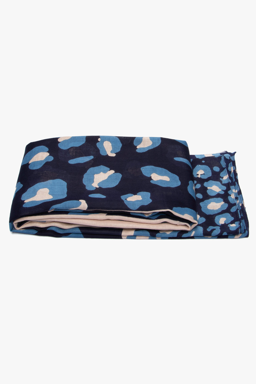 side view of the scarf when folded, showing the texture and thickness of the material. this scarf is lightweight