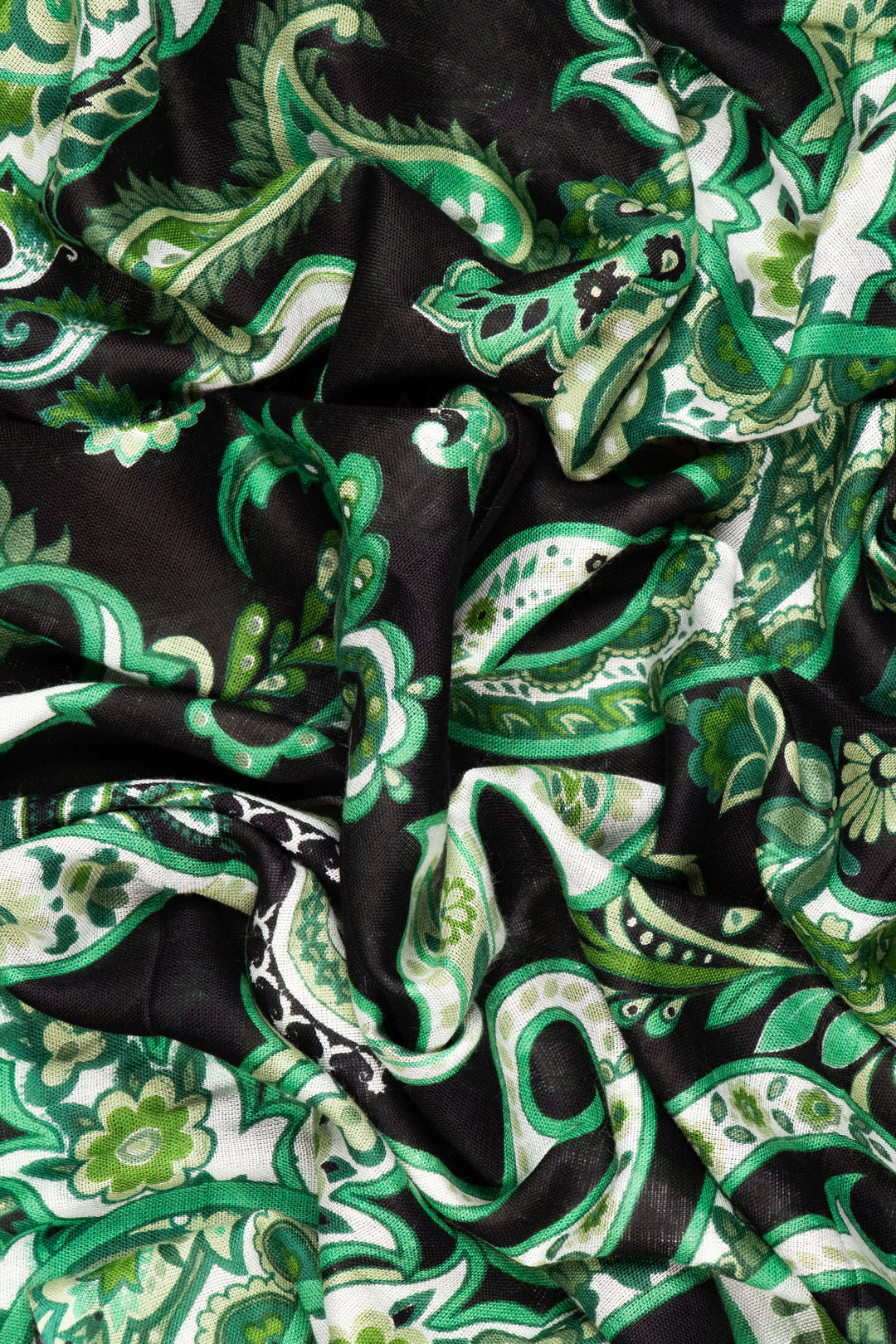 close up of the soft viscose fabric, the black and green colourways are clearly visible