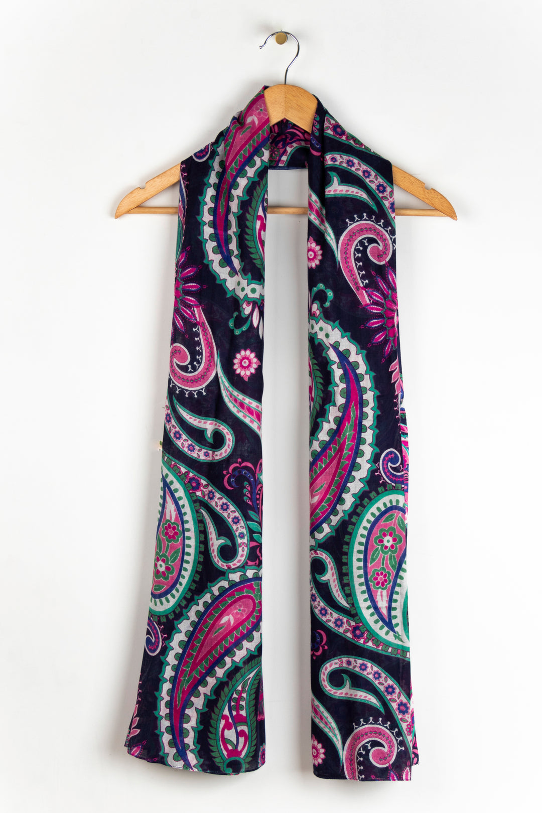 showing the scarf draped around a coat hanger, showing the all over pattern and how it would look when worn