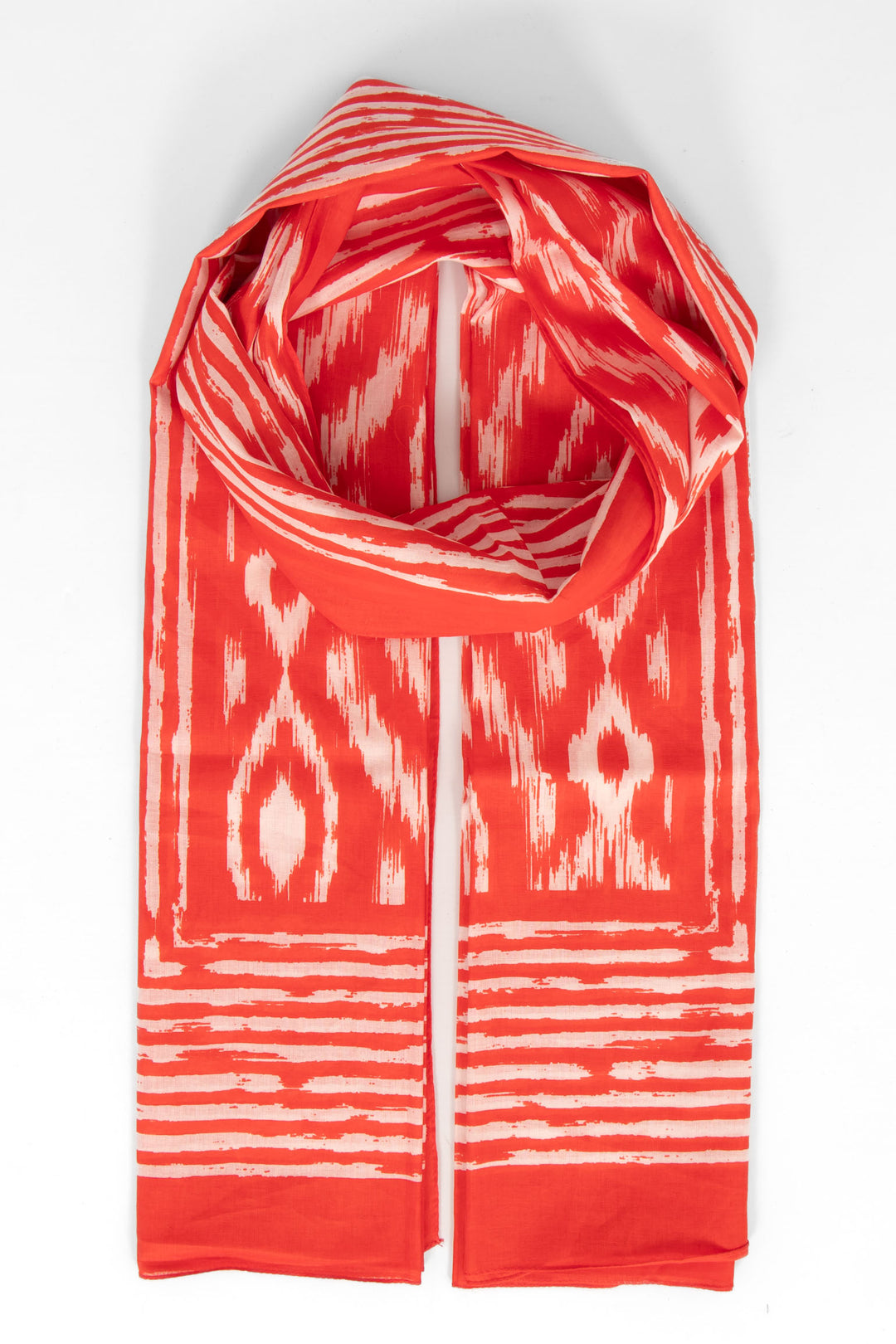 red cotton lightweight aztec scarf. the scarf has an all over pattern and a large bordered edge.