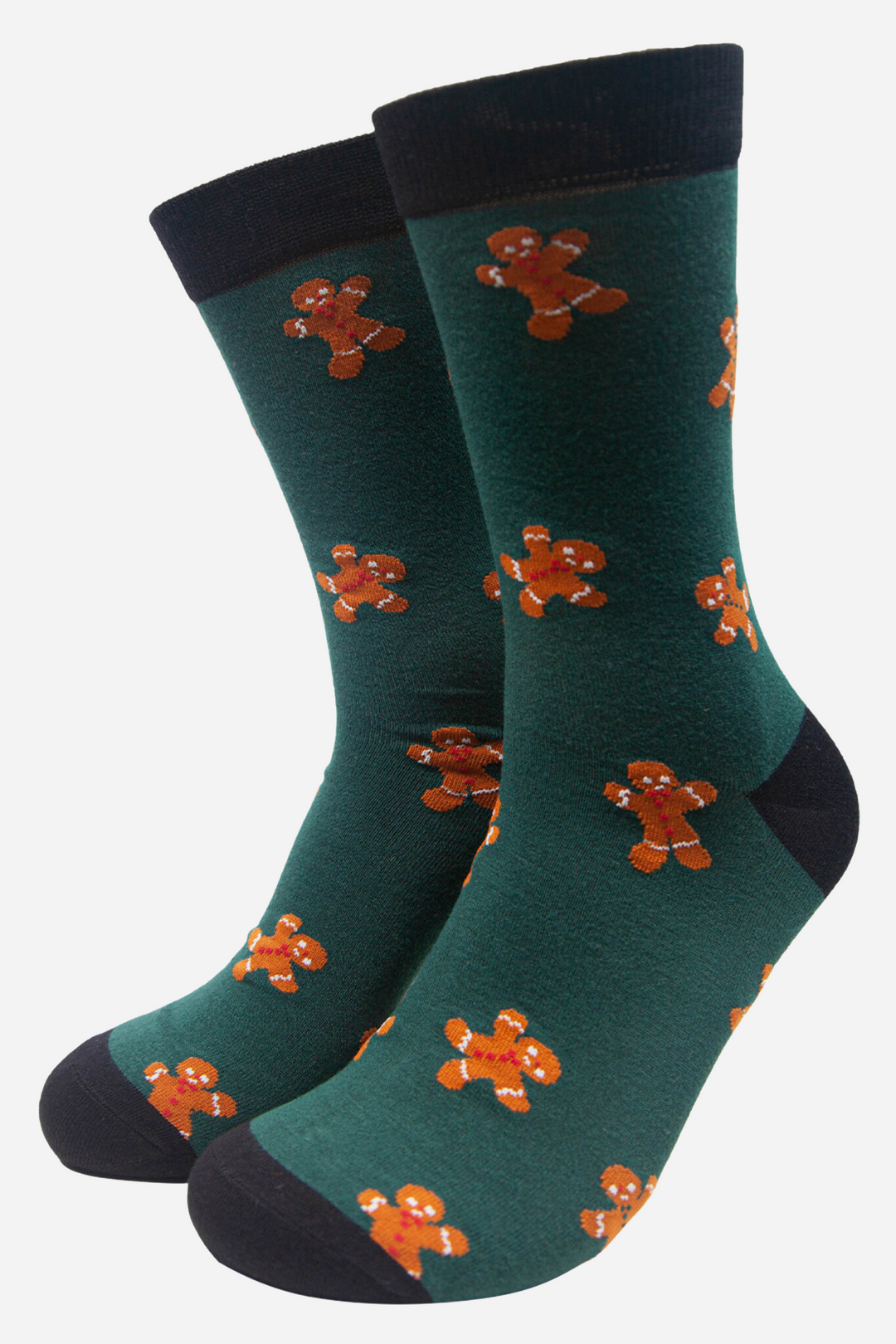 dark green socks with a black heel, toe and cuff with an all over pattern of orange gingerbread men