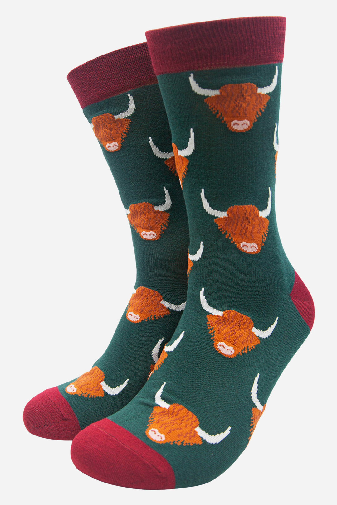 green socks with burgundy heel, toe and cuff with an all over orange highland cow pattern