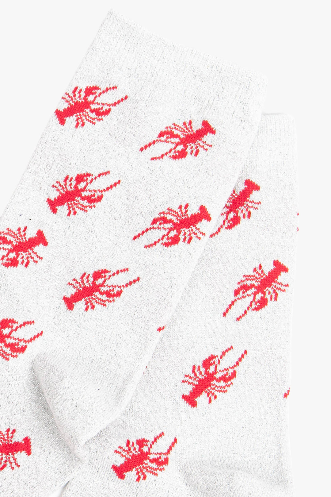 close up of the red lobster pattern on the sparkly ankle socks